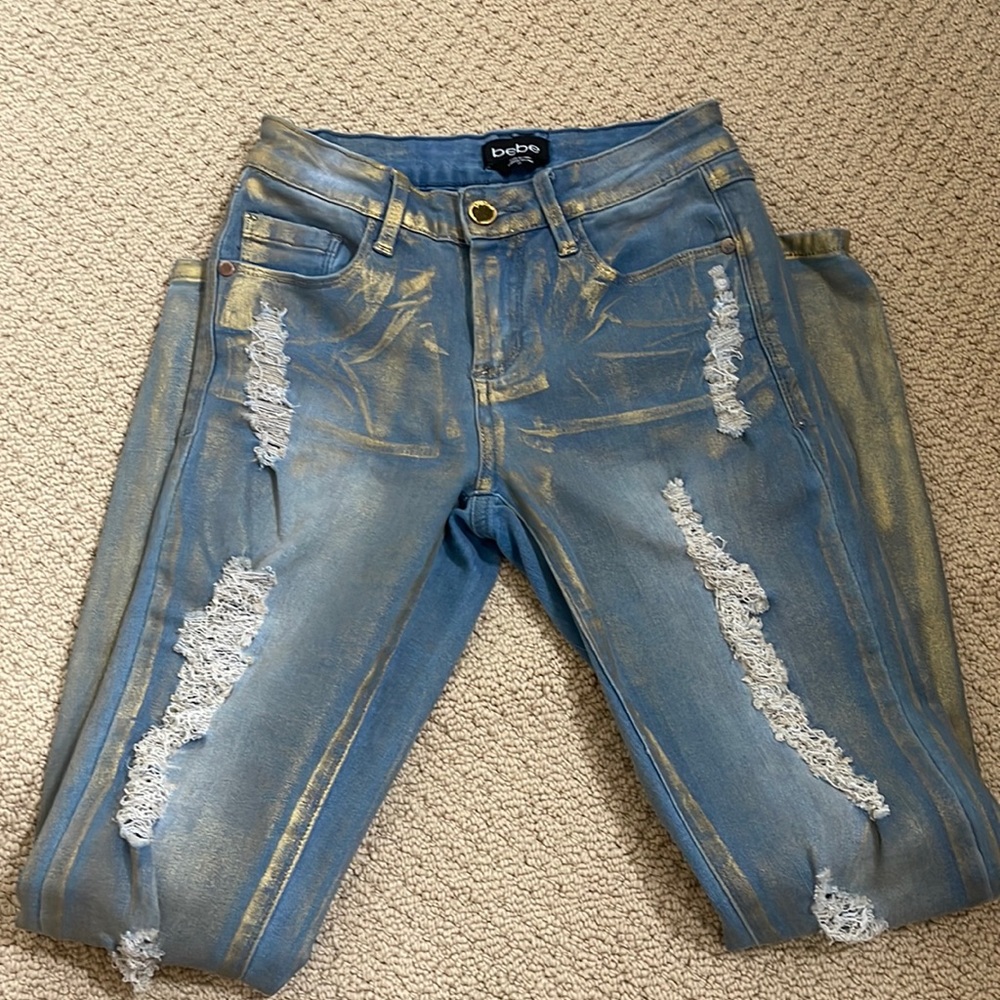 Bebe jeans gold and ripped size 25